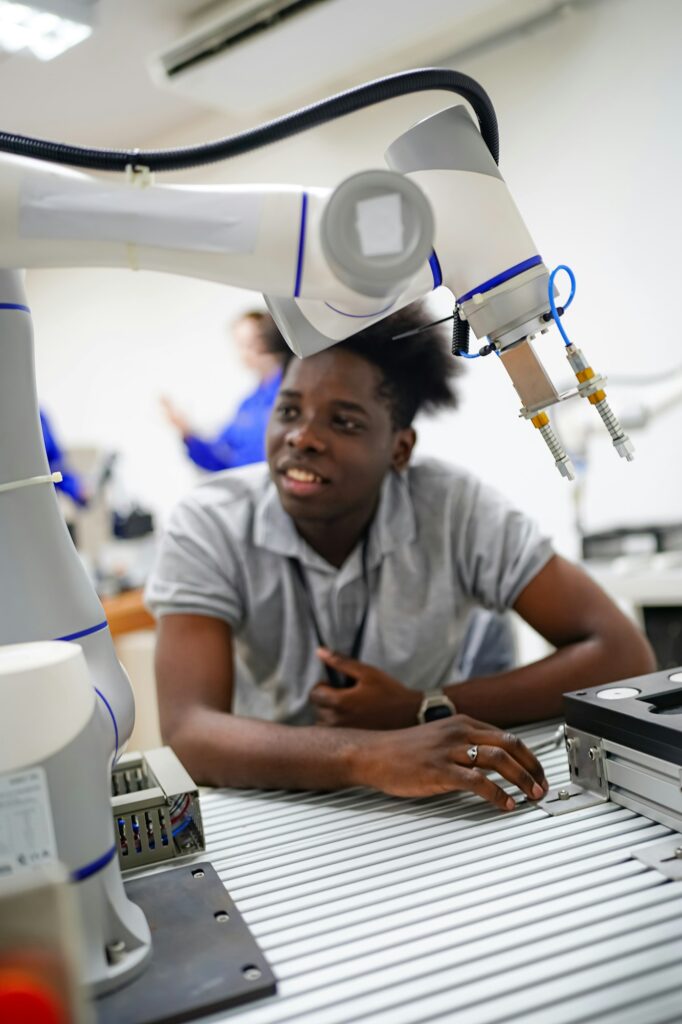 Robotic Arm engineer check on equipment in its with software of Artificial Intelligence Unit.