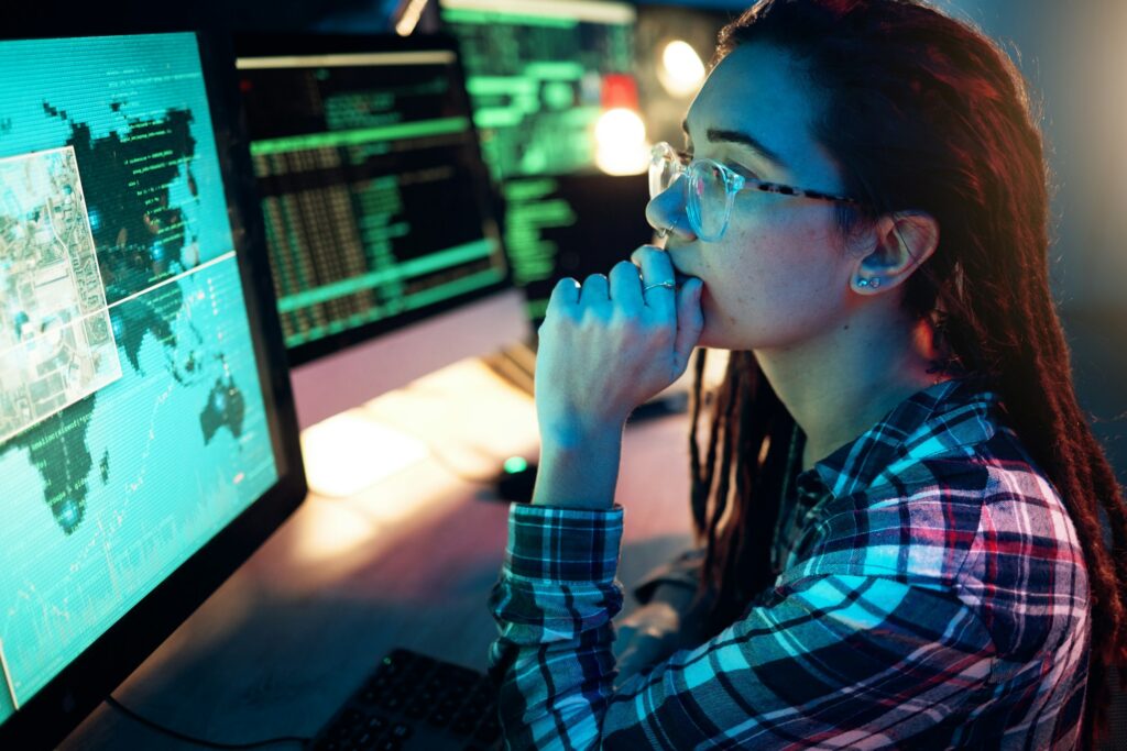 Woman, computer screen and hacker with software, data programming or cybersecurity. Thinking, it co