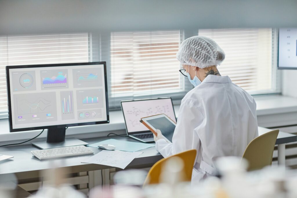 Woman working on digital tablet at the lab