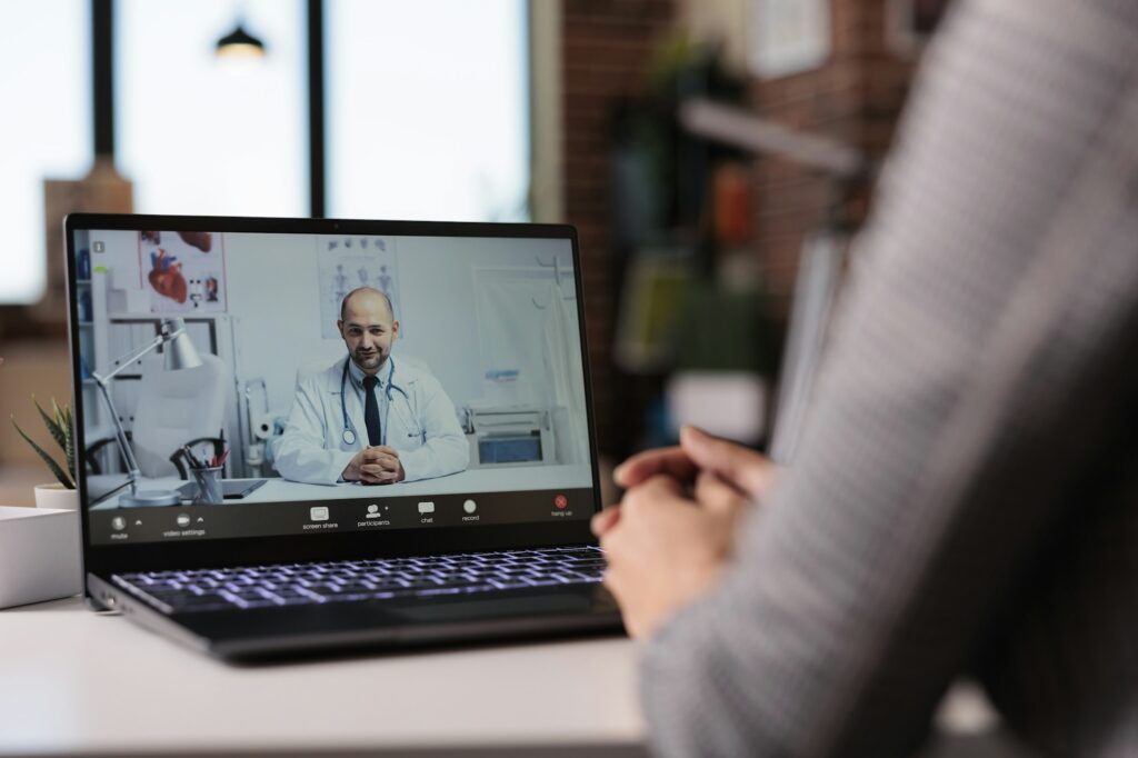 Young woman using videocall telemedicine